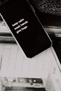 Close-up of a smartphone displaying a motivational hygiene message.